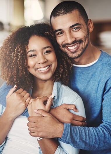 couple hugging and smiling