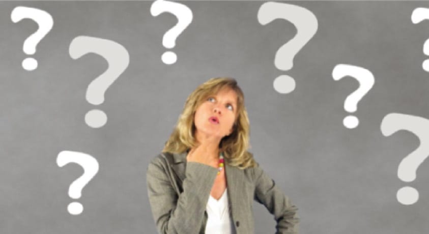 woman surrounded by question marks pondering how long her dental implant restoration will last